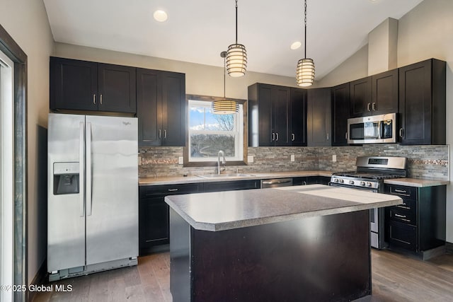 658 Saratoga Rd, Glenville, NY 12302 - kitchen with stainless steel appliances, a sink, lofted ceiling, light wood finished floors, and light countertops