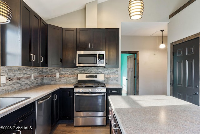 658 Saratoga Rd, Glenville, NY 12302 - kitchen with stainless steel appliances, backsplash, dark wood-type flooring, light countertops, and vaulted ceiling