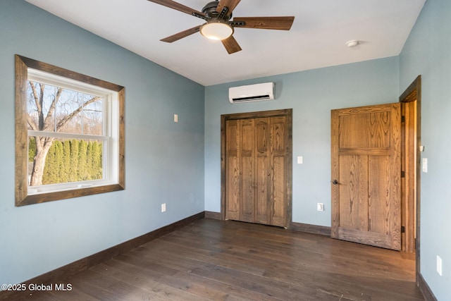 658 Saratoga Rd, Glenville, NY 12302 - unfurnished bedroom featuring a wall unit AC, wood finished floors, baseboards, and a closet