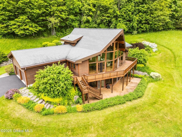 47 County Route 28, Hebron, NY 12832 - back of house featuring a wooden deck, a lawn, and asphalt driveway