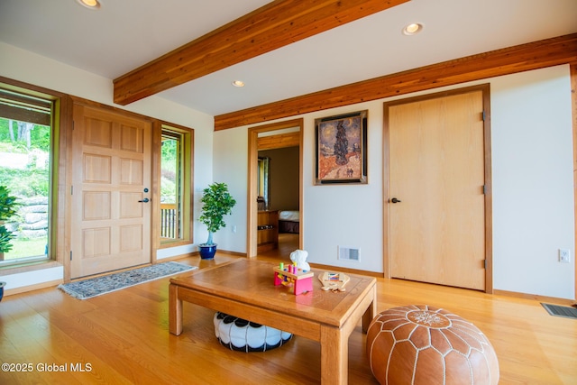 47 County Route 28, Hebron, NY 12832 - living room featuring recessed lighting, beam ceiling, light wood-type flooring, plenty of natural light, and baseboards