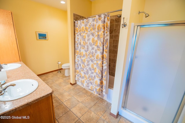 47 County Route 28, Hebron, NY 12832 - bathroom featuring toilet, double vanity, shower / tub combo with curtain, and baseboards