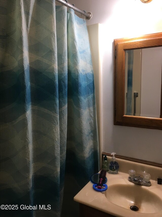 3810 Main St, Warrensburg, NY 12885 - full bath featuring a sink and a shower with shower curtain