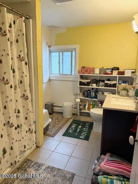 3810 Main St, Warrensburg, NY 12885 - full bathroom with vanity, toilet, tile patterned flooring, and a shower with curtain