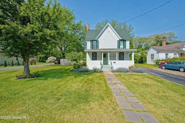970 Main St, Clifton Park, NY 12065 - view of front facade with covered porch, a front lawn, a shingled roof, and a chimney