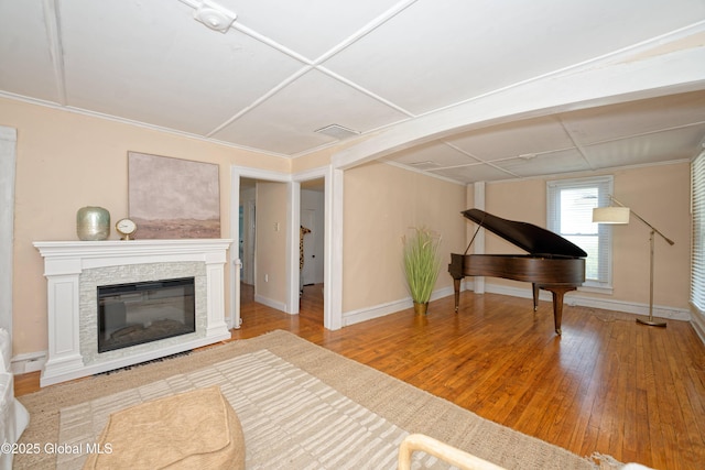 970 Main St, Clifton Park, NY 12065 - living area featuring hardwood / wood-style floors, baseboards, and a stone fireplace
