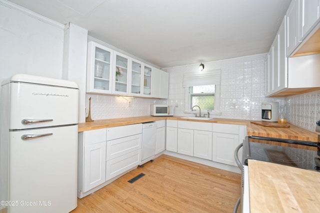 970 Main St, Clifton Park, NY 12065 - kitchen featuring white appliances, butcher block countertops, a sink, and tasteful backsplash