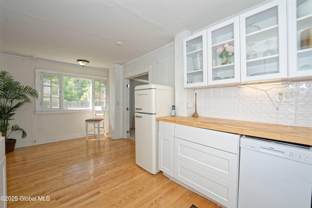 970 Main St, Clifton Park, NY 12065 - kitchen featuring white appliances, light wood-style flooring, decorative backsplash, wooden counters, and white cabinetry