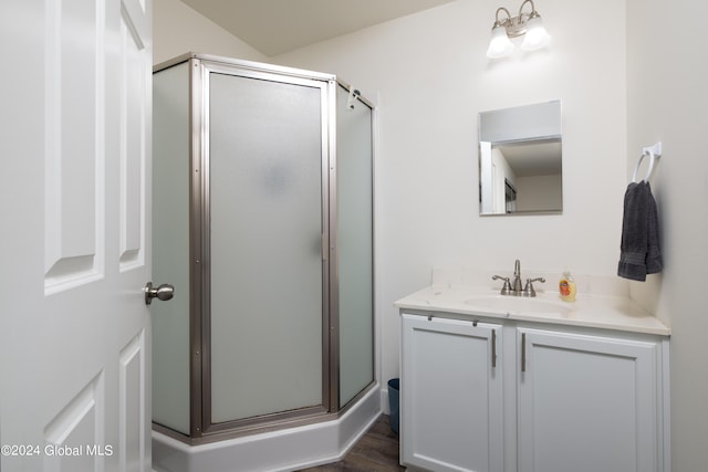 51 Rollman Cir, Hadley, NY 12835 - bathroom with vanity, a stall shower, and wood finished floors