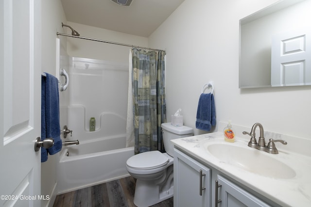 51 Rollman Cir, Hadley, NY 12835 - full bathroom with vanity, shower / bath combo with shower curtain, toilet, and wood finished floors