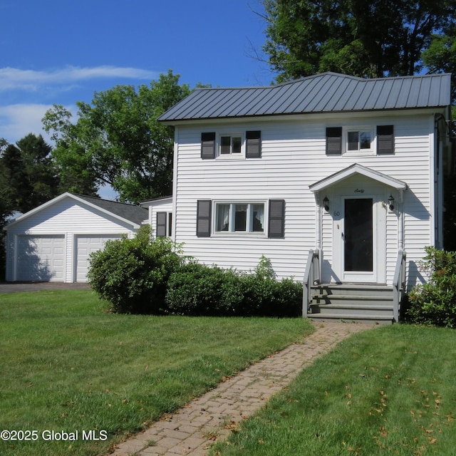60 Bridge St, Broadalbin, NY 12025 - view of front of property featuring a detached garage, a front lawn, and a metal roof