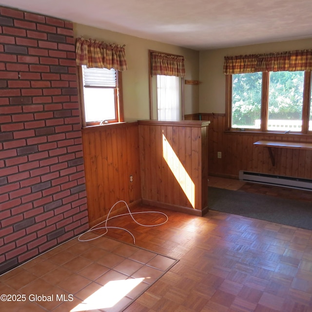 60 Bridge St, Broadalbin, NY 12025 - unfurnished room with wainscoting, a baseboard radiator, and wooden walls