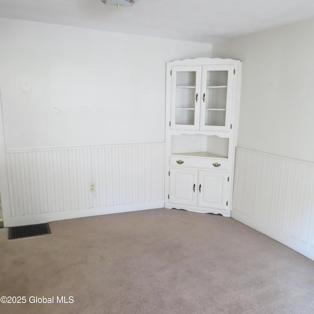 60 Bridge St, Broadalbin, NY 12025 - empty room with carpet floors and wainscoting