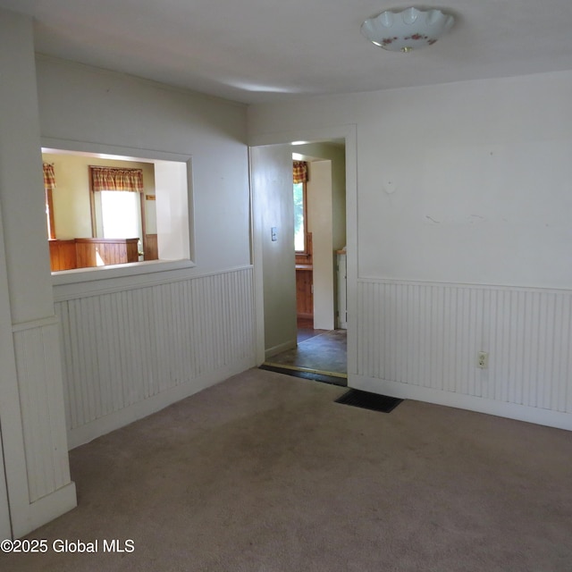 60 Bridge St, Broadalbin, NY 12025 - carpeted empty room featuring wainscoting