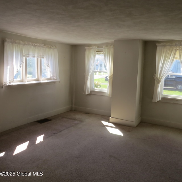 60 Bridge St, Broadalbin, NY 12025 - carpeted empty room with baseboards and a textured ceiling