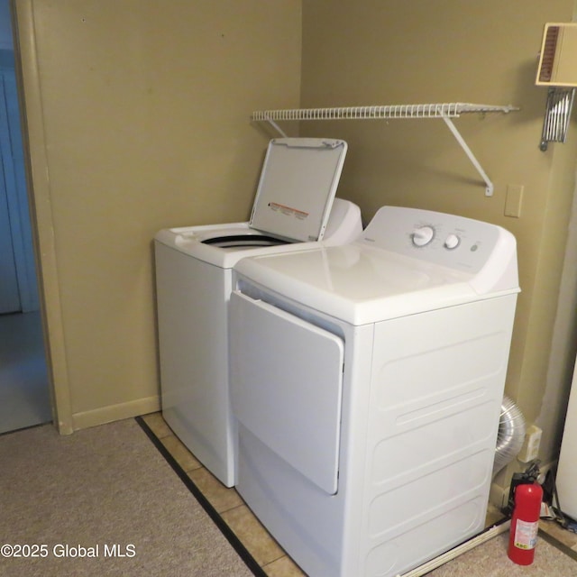 60 Bridge St, Broadalbin, NY 12025 - laundry area with washing machine and clothes dryer and light tile patterned floors
