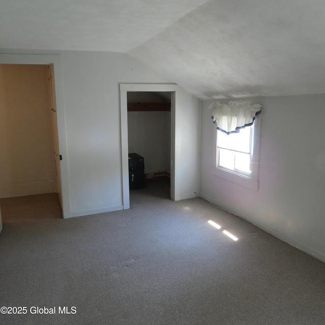 60 Bridge St, Broadalbin, NY 12025 - unfurnished room featuring lofted ceiling and carpet floors