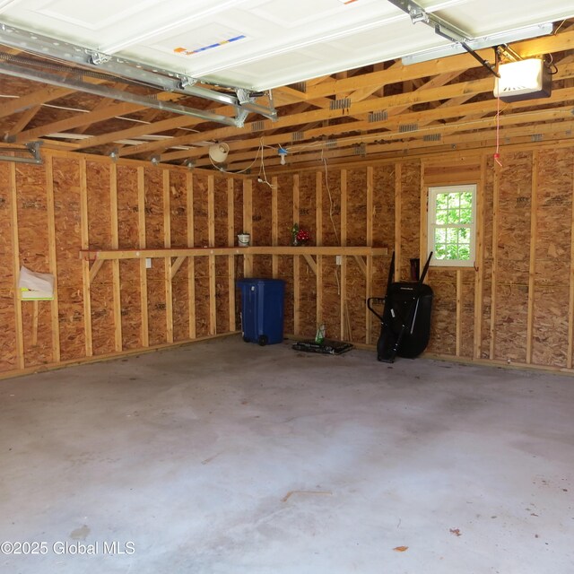 60 Bridge St, Broadalbin, NY 12025 - garage featuring a garage door opener