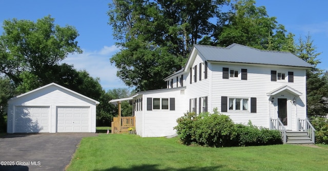 60 Bridge St, Broadalbin, NY 12025 - view of side of property with an outbuilding, a garage, and a lawn