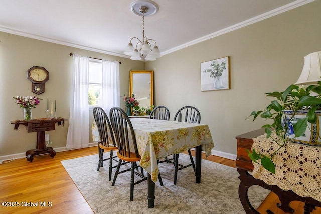 209 Whitehall Rd, Albany, NY 12209 - dining space featuring ornamental molding, a chandelier, baseboards, and light wood-type flooring