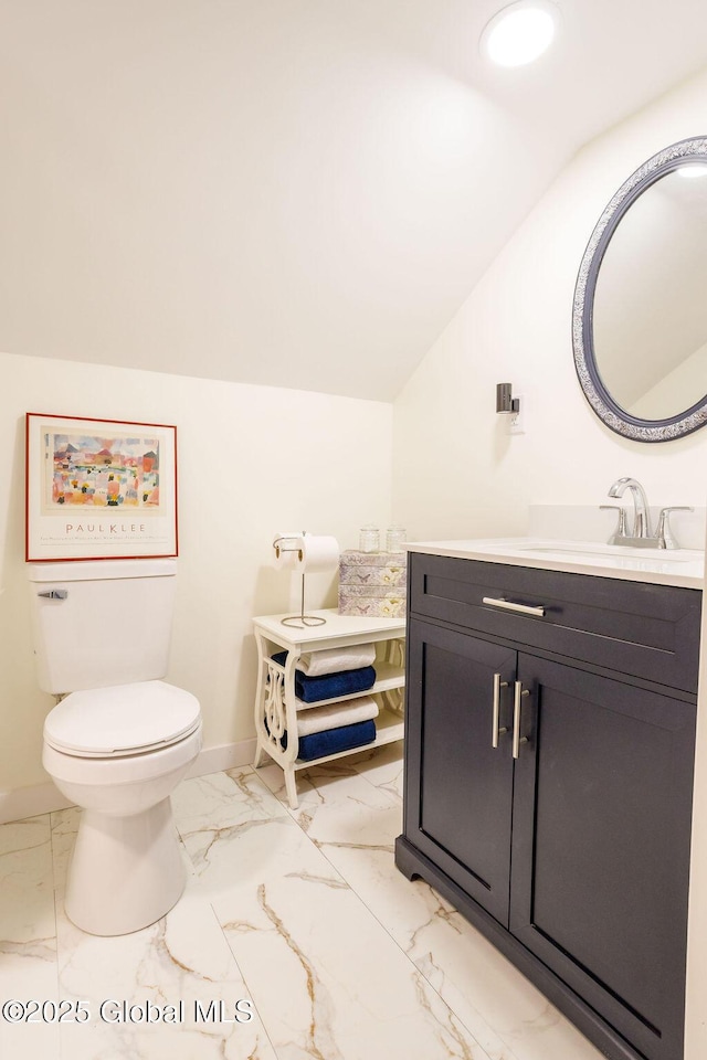 209 Whitehall Rd, Albany, NY 12209 - bathroom with marble look tiles, vanity, baseboards, lofted ceiling, and toilet
