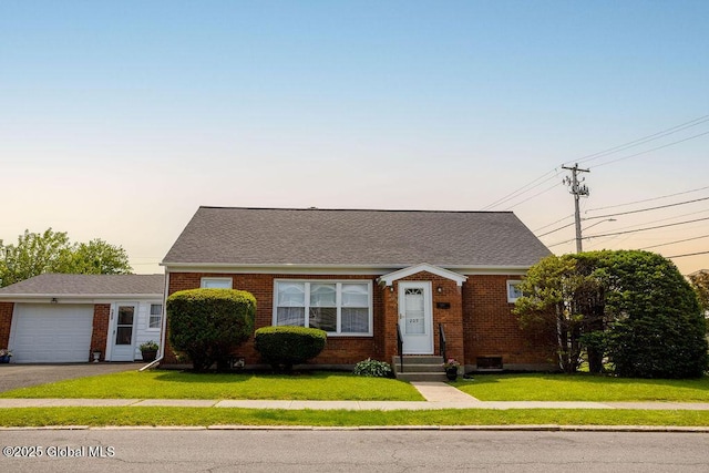 209 Whitehall Rd, Albany, NY 12209 - view of front of property with entry steps, brick siding, a lawn, and driveway