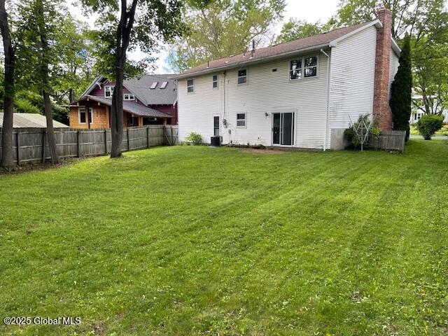 2070 Grand Blvd, Niskayuna, NY 12309 - back of house featuring a chimney and cooling unit