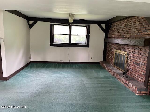 2070 Grand Blvd, Niskayuna, NY 12309 - unfurnished living room featuring carpet floors, baseboards, and a fireplace