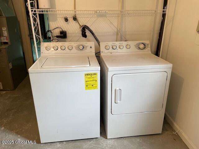 2070 Grand Blvd, Niskayuna, NY 12309 - laundry room with independent washer and dryer, heating unit, and baseboards