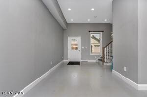 138 Lydon Ln, New Baltimore, NY 12087 - foyer entrance with recessed lighting, stairs, concrete flooring, and baseboards