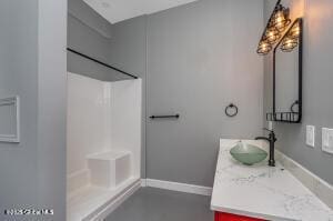 138 Lydon Ln, New Baltimore, NY 12087 - bathroom with vanity, a shower, and baseboards
