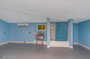 138 Lydon Ln, New Baltimore, NY 12087 - empty room with a wall mounted air conditioner and baseboards