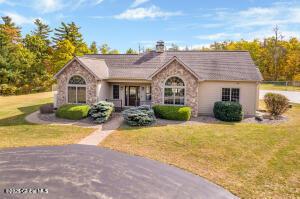 138 Lydon Ln, New Baltimore, NY 12087 - ranch-style house featuring stone siding and a front yard