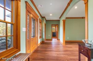 138 Lydon Ln, New Baltimore, NY 12087 - corridor featuring ornamental molding, wood finished floors, baseboards, decorative columns, and recessed lighting
