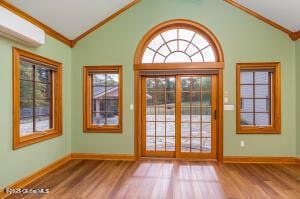 138 Lydon Ln, New Baltimore, NY 12087 - doorway featuring crown molding, lofted ceiling, wood finished floors, baseboards, and plenty of natural light