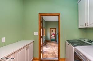 138 Lydon Ln, New Baltimore, NY 12087 - laundry area featuring cabinet space and washing machine and clothes dryer