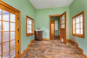 138 Lydon Ln, New Baltimore, NY 12087 - doorway to outside featuring baseboards