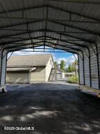 138 Lydon Ln, New Baltimore, NY 12087 - view of parking / parking lot with a carport