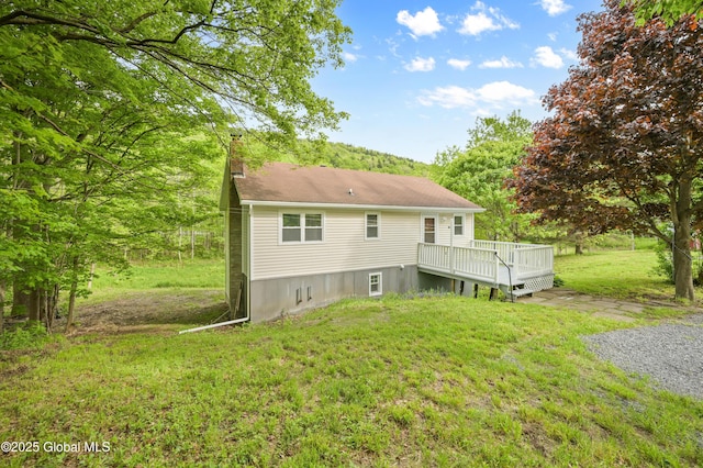10610 State Highway 7, Worcester, NY 12064 - rear view of house with a chimney, a deck, and a yard