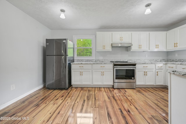 10610 State Highway 7, Worcester, NY 12064 - kitchen featuring freestanding refrigerator, stainless steel electric stove, under cabinet range hood, white cabinets, and light wood-style floors