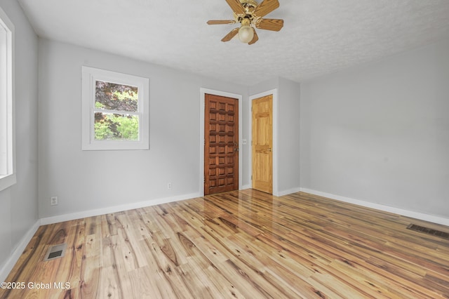 10610 State Highway 7, Worcester, NY 12064 - spare room with wood finished floors, baseboards, and a ceiling fan