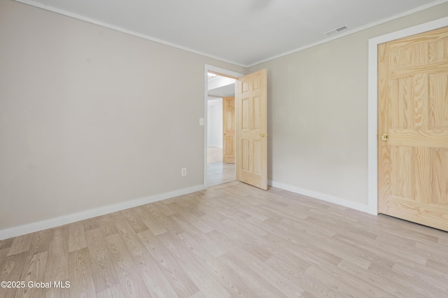 10610 State Highway 7, Worcester, NY 12064 - unfurnished bedroom with light wood finished floors, crown molding, and baseboards