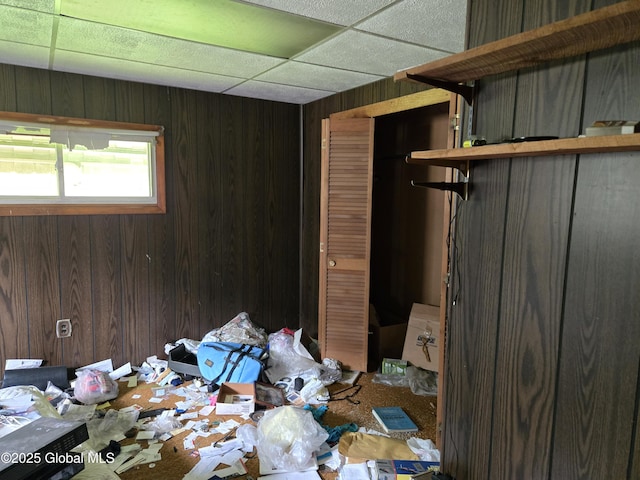 4 S E Ave, Johnstown, NY 12095 - unfurnished bedroom featuring wood walls and a drop ceiling