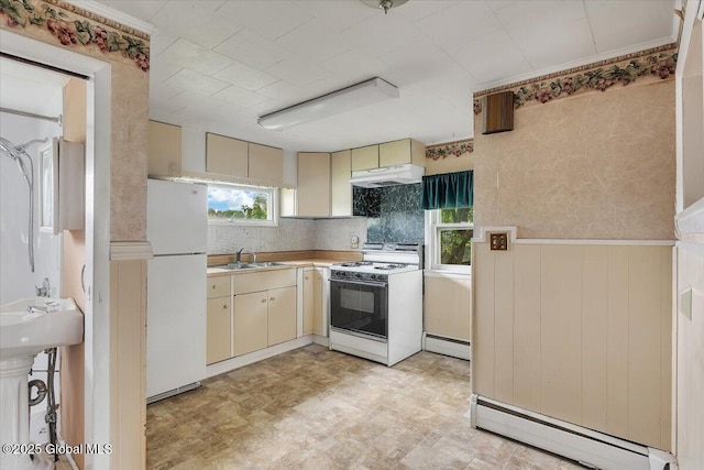 27 Washington Ave, Colonie, NY 12205 - kitchen featuring white appliances, cream cabinetry, a baseboard radiator, and under cabinet range hood