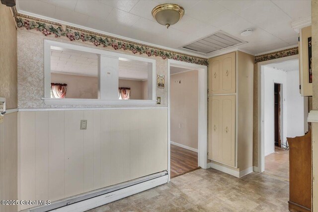 27 Washington Ave, Colonie, NY 12205 - empty room with baseboard heating, a smoke detector, and crown molding