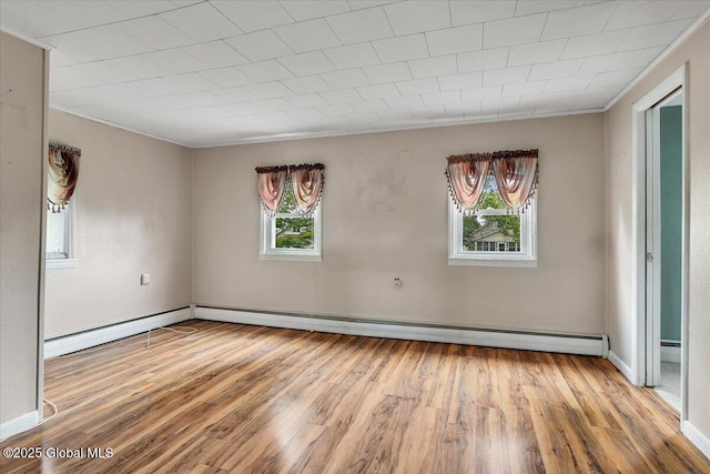 27 Washington Ave, Colonie, NY 12205 - spare room with wood finished floors, crown molding, and baseboards