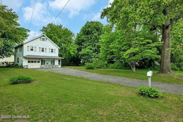 27 Washington Ave, Colonie, NY 12205 - view of front of property with driveway, a front yard, and an attached garage