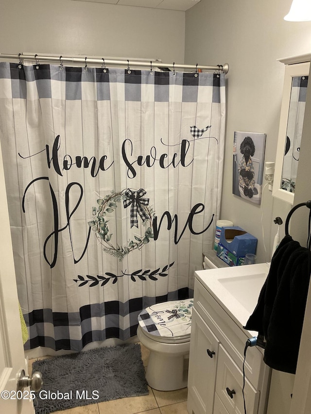 129 Okara Dr, Guilderland, NY 12303 - full bathroom with vanity, toilet, curtained shower, and tile patterned floors