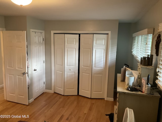 129 Okara Dr, Guilderland, NY 12303 - bedroom with light wood-style flooring, a closet, and baseboards