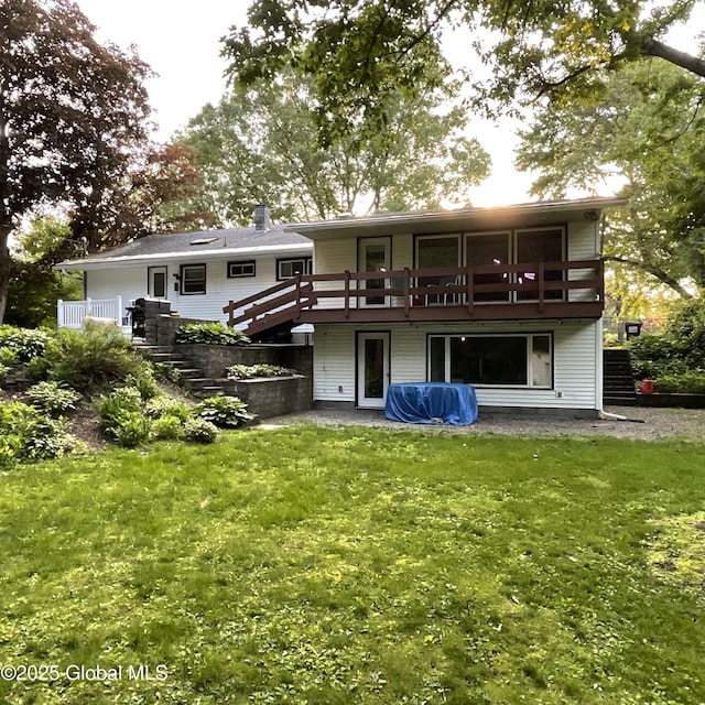 129 Okara Dr, Guilderland, NY 12303 - rear view of house featuring stairway, a yard, and a wooden deck